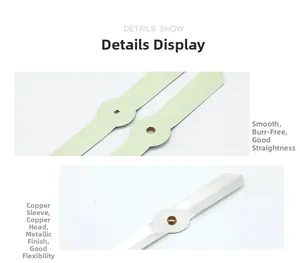 Detailed macro view of luminous clock hands with a copper sleeve and smooth metallic texture