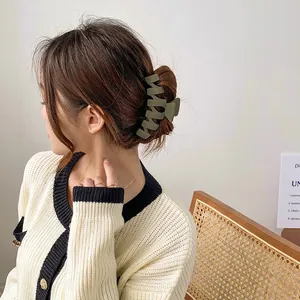 Olive green matte shark hair claw clip for elegant bun hairstyles on women