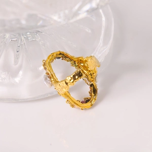 Irregular gold titanium steel ring featuring inlaid pearls and colorful gemstones