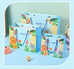 Three sizes of light blue gift bags with cartoon forest animals and blue handles