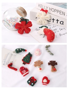 Detailed view of handmade Christmas wool felt ornaments including elk and stockings