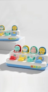 Detail of baby pop-up toy with colorful buttons and cute animals for fine motor skills