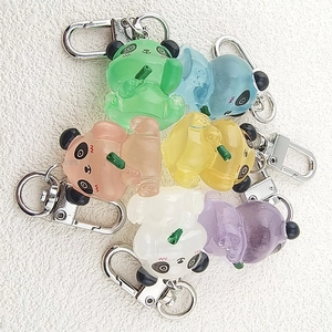 Panda glow-in-the-dark resin keychains in six jelly colors with bamboo details