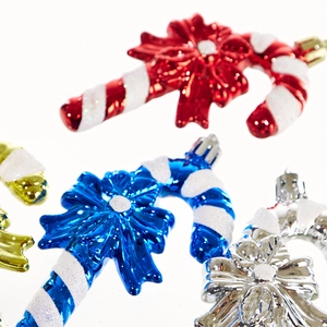 Glittery candy cane Christmas tree ornaments with colorful metallic finishes and bows