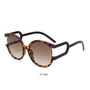 Chic round tortoiseshell sunglasses with brown gradient lenses and unique hollow circular temples