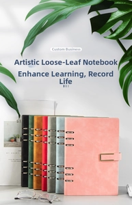 Close-up of A5 business loose-leaf notebooks showing colorful faux leather covers and gold magnetic buckles