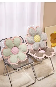 Detailed view of floral plush seat cushion with pink faux fur edges and plaid center