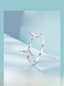 Macro shot of 925 sterling silver flying kingfisher ring with adjustable open band details