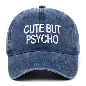 Deep blue washed denim baseball cap featuring white CUTE BUT PSYCHO embroidery