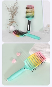 Detail of gradient vented hairbrush with boar bristles for volumizing and detangling hair