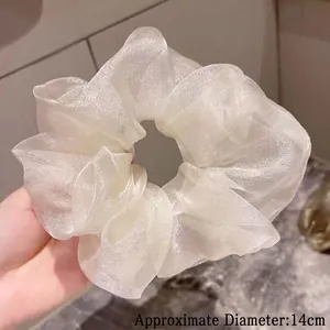 Detailed view of 14cm pearlescent organza scrunchie with a shimmering finish