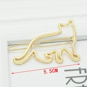 Gold hollow metal cat hair clip measuring 5.5cm in length with a minimalist design