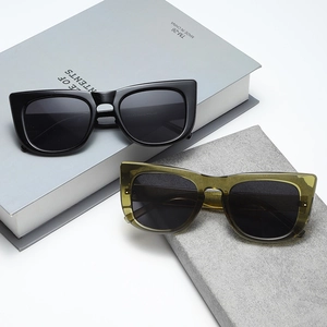Retro small frame cat-eye sunglasses in black and transparent olive green colors