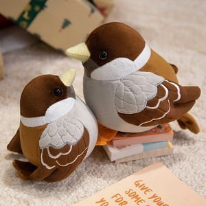Plush sparrow bird toys in large and small sizes on a cozy beige rug background