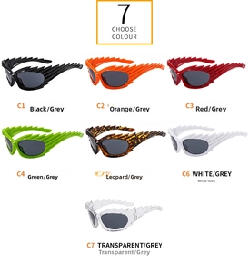 Selection of seven colorful winged flame sunglasses with dark grey lenses and unique frames
