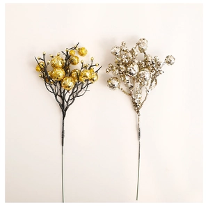 Detailed view of festive gold and silver glitter ball picks for Christmas decoration