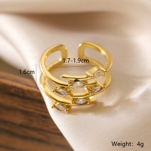 Macro view of 18K gold plated multi-layer ring with sparkling cubic zirconia settings