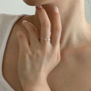 Minimalist S925 sterling silver thin ring with heart zirconia worn by a model