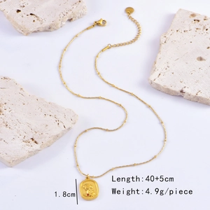 Detailed macro view of gold rose relief pendant showing dimensions and pendant weight