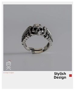 Detail shot of vintage silver skull ring with wings and S925 engraved hallmark