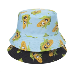 Double-sided reversible bucket hats featuring cartoon corn print in light blue and black