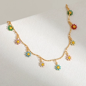 Handmade enamel daisy pendant necklace with colorful floral charms on a gold chain
