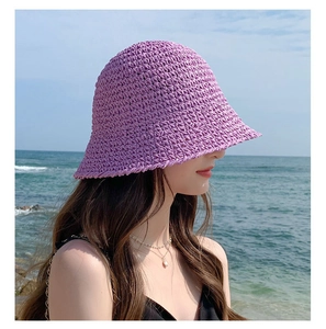 Detail of purple woven bucket hat with breathable texture for beach sun protection