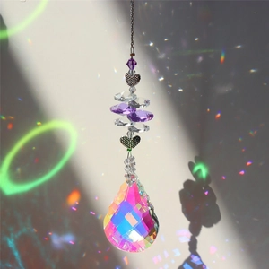 Creative crystal hanging ornament with heart-shaped metal accents and iridescent drop pendant