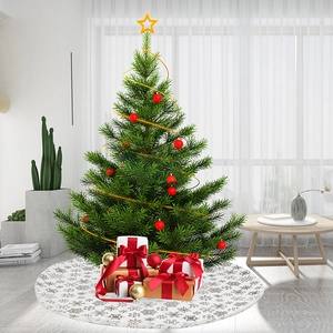 White plush Christmas tree skirt featuring silver foil snowflakes in a cozy living room decor
