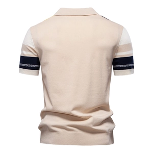 Men's beige knit polo shirt with navy and white striped cuffs from a back view perspective