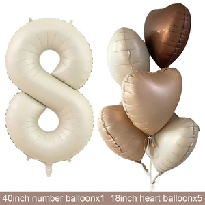 Detail of cream 40 inch number 8 balloon with matching heart shaped party decorations