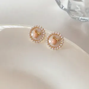 French vintage floral pearl stud earrings with pink enamel center and gold bow detail