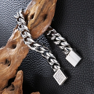 Detailed macro view of heavy stainless steel cuban chain bracelet with CNC set diamonds