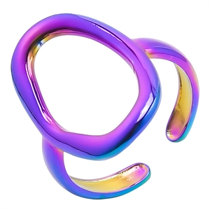 Macro shot of iridescent rainbow stainless steel open ring with fluid wavy design