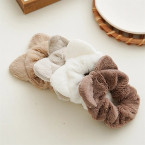 Detailed set of four plush scrunchies with cute animal ears in beige, grey, white, and brown