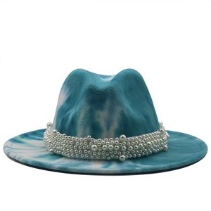 Close-up of tie-dye wool fedora hat featuring a luxury white pearl beaded decorative band
