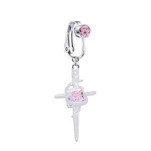 Detail of silver clip-on navel ring with pink zircon cross and sword pendant
