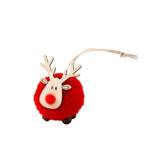Christmas reindeer ornament with red wool felt ball body and wooden antlers for tree decor