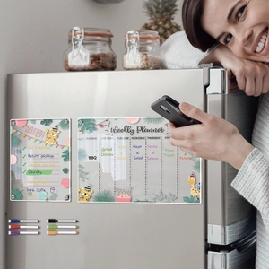 Acrylic magnetic weekly planner on fridge with colored markers and animal designs