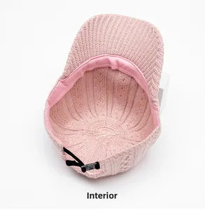 Detail of pink knit baseball cap interior with sweatband and adjustable buckle
