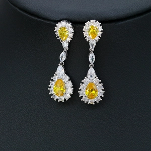 Exquisite gold-tone drop earrings with vibrant yellow water-drop stones and white zircon details