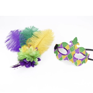 Detail of Mardi Gras party set with purple green and gold sequin mask and feather flower