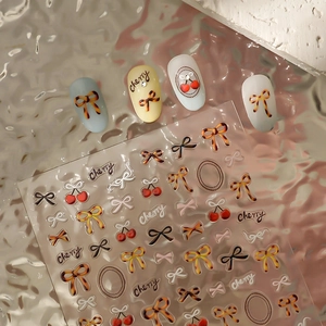 Leopard print bow and cherry nail art stickers set on textured glass background