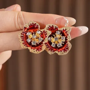 Vintage red enamel flower earrings with gold accents and sparkling crystals for women