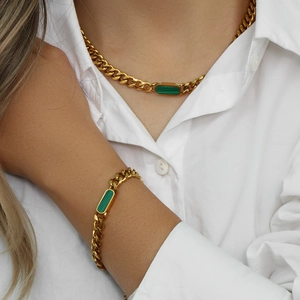 Close-up of 18K gold plated Cuban chain set with rectangular green malachite stones