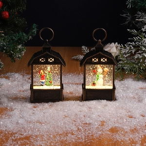 Vintage bronze Christmas lanterns with snowman and Santa scenes on snowy wood surface