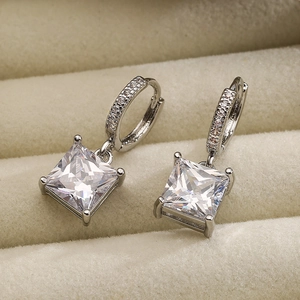 Elegant silver square zircon drop earrings with cz pavé hoops in a beige jewelry box