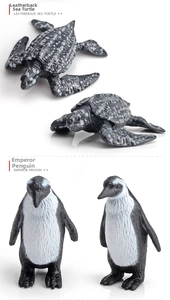 Detailed realistic miniature leatherback sea turtle and emperor penguin animal figurines