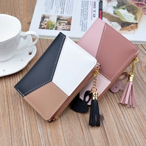 Short zipper wallet for women with color block design and rabbit tassel pendant detail