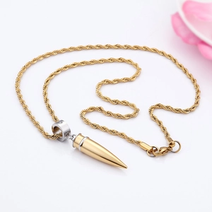 Detail of gold-silver bullet pendant with twisted chain on a clean white background